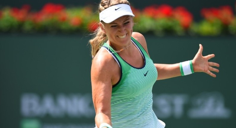 Victoria Azarenka of Belarus returns the ball to Serena Williams of USA in the women's final of the BNP Paribas Open at the Indian Wells Tennis Garden in Indian Wells, California, March 20, 2016