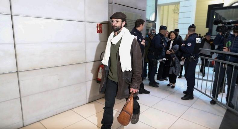 French farmer Cedric Herrou (L) is one of three people to appear before the courts in southern France for assisting migrants fleeing war, poverty and persecution