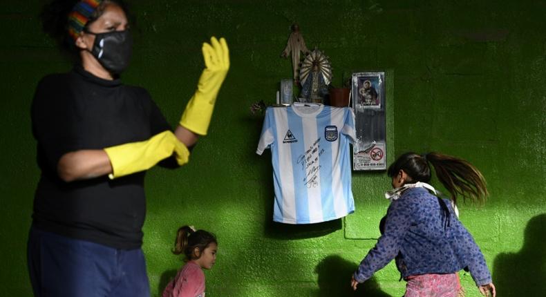 Diego Maradona's autographed shirt is displayed at a community eatery in Buenos Aires