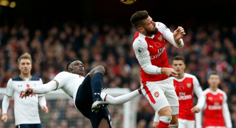 Tottenham Hotspur's Victor Wanyama (L) clashes with Arsenal's Olivier Giroud during the match in London on November 6, 2016