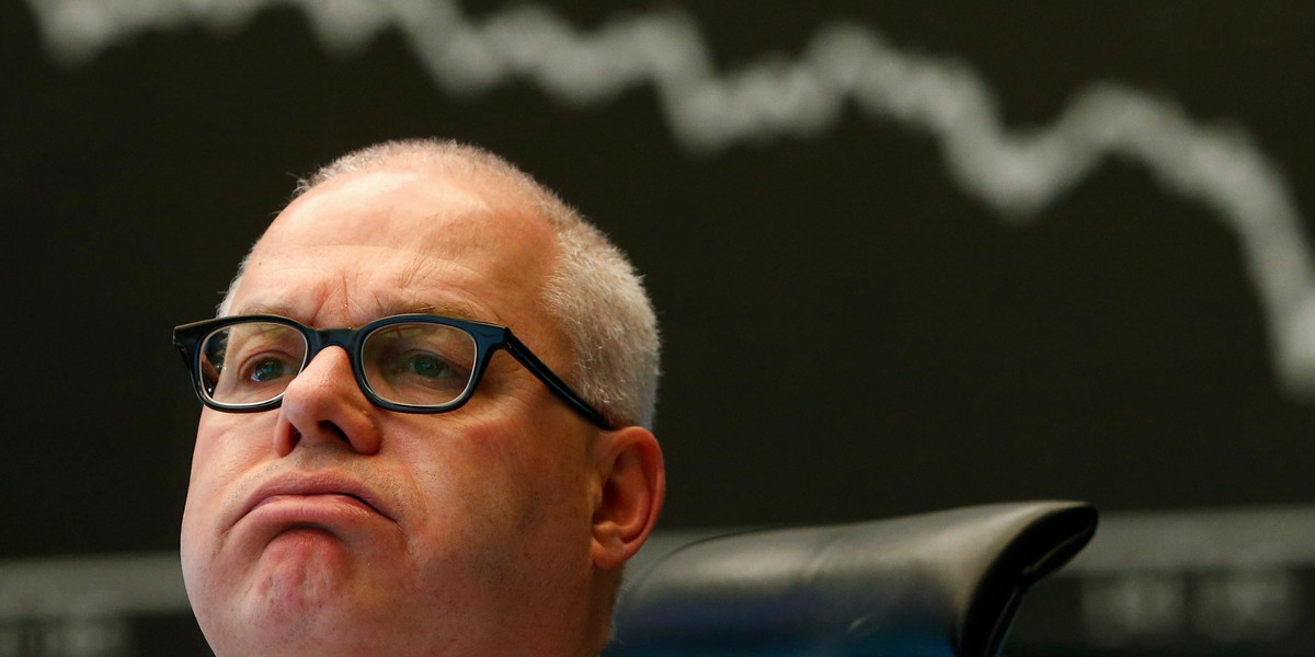 A trader reacts at Frankfurt stock exchange January 29, 2014.