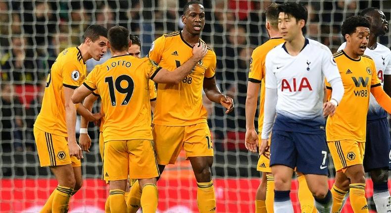 Boly blow: Tottenham's title charge crashed to a halt after Willy Boly (centre) levelled for Wolves at Wembley