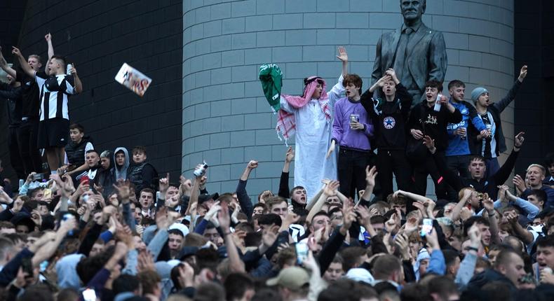 Newcastle United fans celebrate at St James' Park following the announcement that The Saudi-led takeover of Newcastle has been approved on Thursday October 7, 2021.
