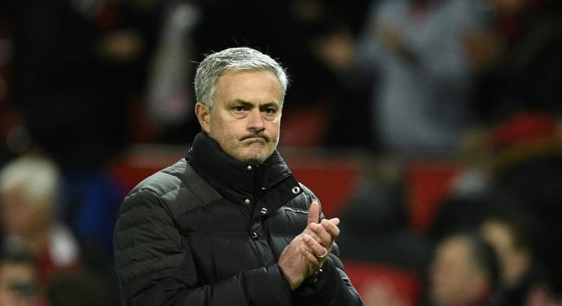 Manchester United's manager Jose Mourinho applauds after the English Premier League football match on December 11, 2016