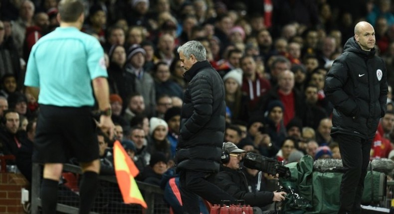 Manchester United's manager Jose Mourinho (C) leaves the touchline after referee Jonathan Moss sent him to the stands during the English Premier League football match between Manchester United and West Ham United on November 27, 2016