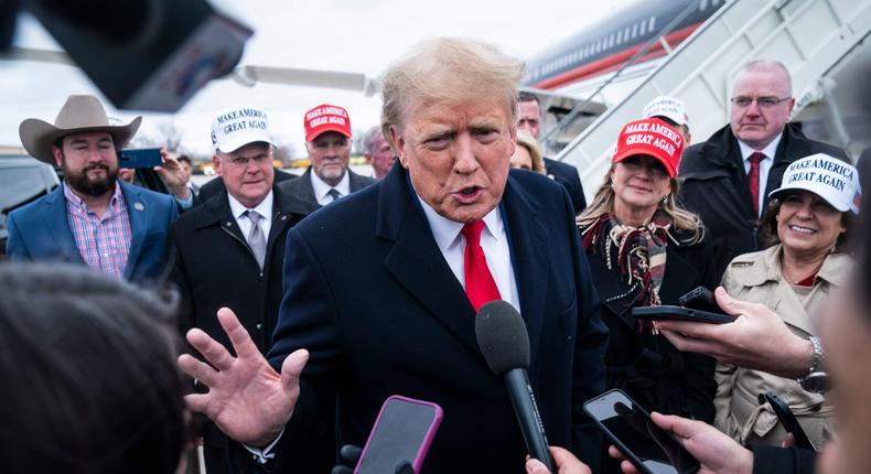 Former President Donald Trump speaks with reporters as he lands at Quad City International Airport en route to Iowa on Monday, March 13, 2023.Jabin Botsford/The Washington Post via Getty Images