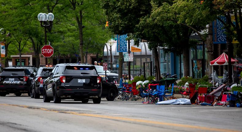 Police vehicles at the scene of the Fourth of July parade shooting in Highland Park, Illinois on Monday.