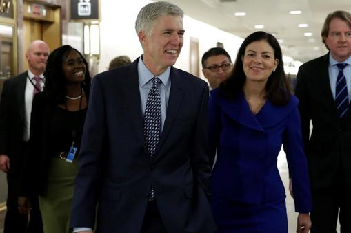 Supreme Court nominee Judge Neil Gorsuch (C) arrives for a meeting with Senator Bob Corker