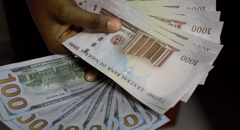 Naira and dollar [Ripples Nigeria]