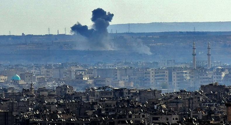 Smoke billows from the southern suburbs of Aleppo during fighting between regime forces and rebel fighters on December 3, 2016