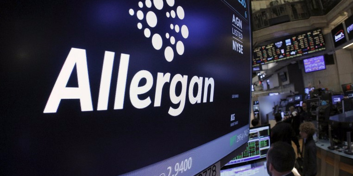 Allergan ticker info and symbol are displayed on a screen on the floor of the NYSE