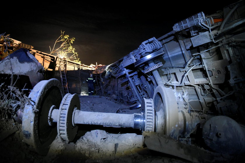 A derailed train carriage is seen toppled in the town of Adendro in northern Greece