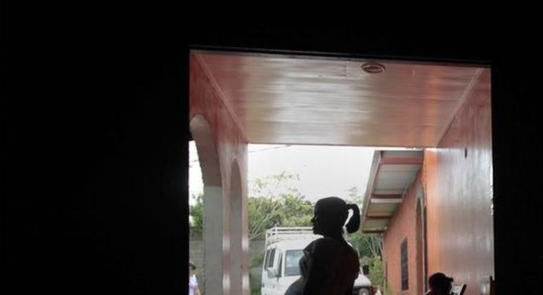 Pregnant teenagers stand at the entrance of a maternity home in Jinotega city, some 160 km (99 miles) north of Managua October 24, 2013. REUTERS/Oswaldo Rivas