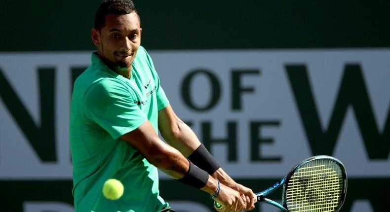Nick Kyrgios of Australia returns a shot to Novak Djokovic of Serbia during the BNP Paribas Open at the Indian Wells Tennis Garden on March 15, 2017 in Indian Wells, California