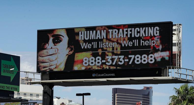 A billboard displays a phone number for the National Human Trafficking Hotline in Las Vegas.