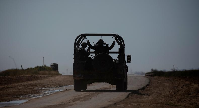 Israeli soldiers sit in an army vehicle moving near the border with the Gaza Strip, on March 25, 2024, in southern Israel.Amir Levy/Getty Images