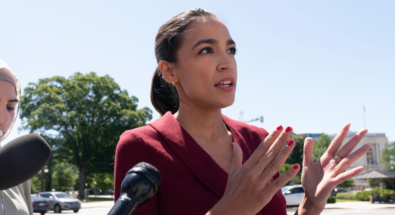 Rep. Alexandria Ocasio-Cortez, D-N.Y., speaks with reporters, Thursday, June 17, 2021, as she arrives on Capitol Hill in Washington. (
