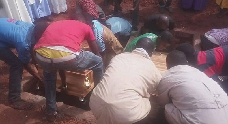 The family members during the burial