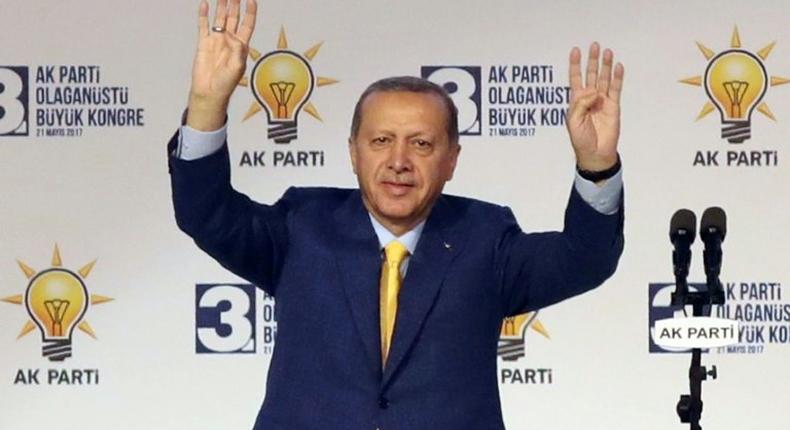 Turkish President Tayyip Erdogan waves to supporters during an extraordinary congress of the ruling AK Party (AKP) in Ankara, on May 21, 2017