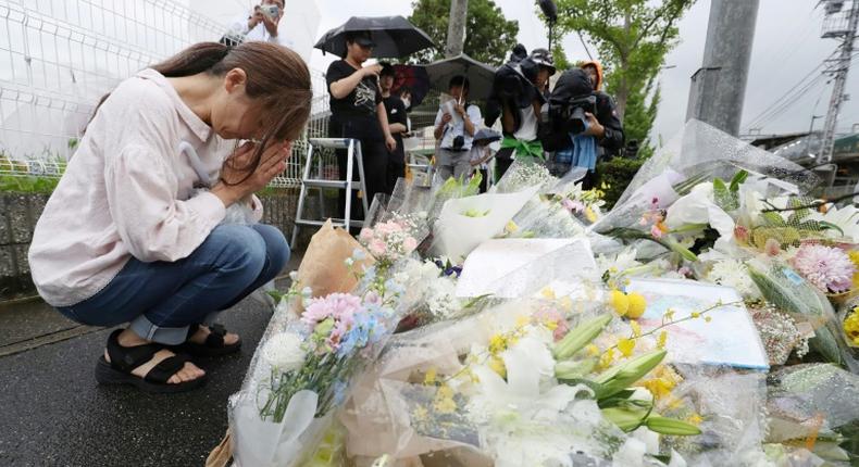 People continued to pay tribute to the victims on Saturday, leaving flowers