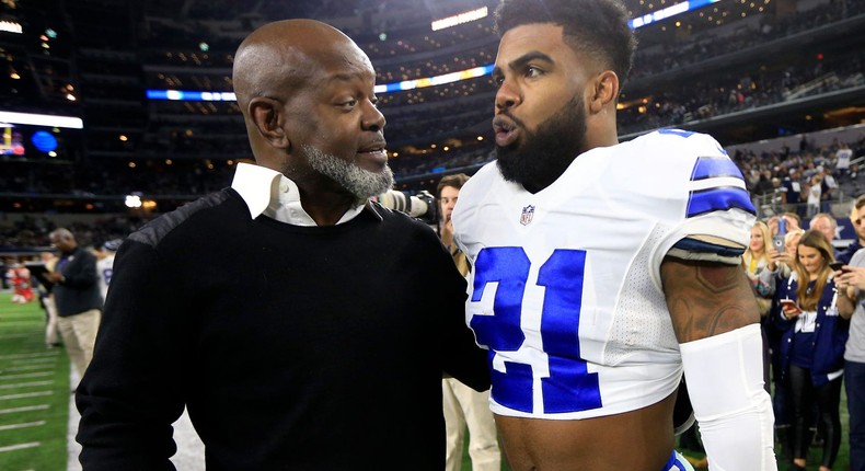 Emmitt Smith speaks with Ezekiel Elliott before a game against the Tampa Bay Buccaneers.AP Photo/Ron Jenkins