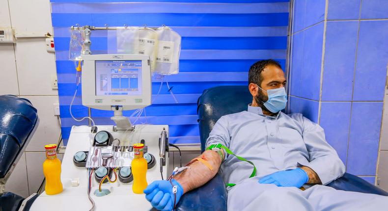 A recovered coronavirus (COVID-19) patient donates blood samples for plasma extraction to help critically ill patients at the National Blood Transfusion Center.