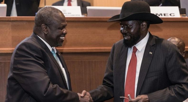 President Salva Kiir (R) and his former deputy turned rebel leader Riek Machar (L) signed a peace deal last week