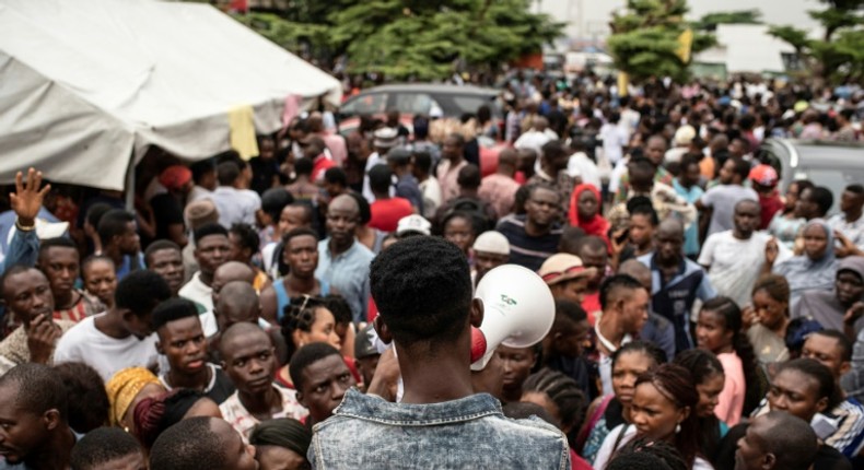 Election call: People in Lagos gathered ahead of polling day to pick up the biometric card entitling them to vote