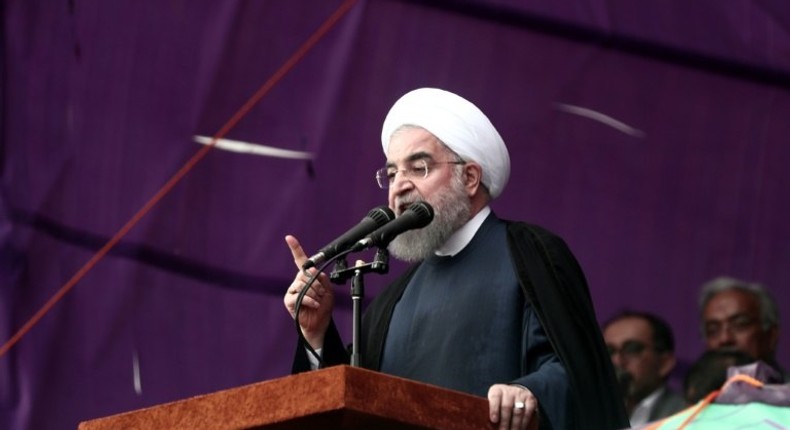 The decision not to renew sanctions on Iran's nuclear program may boost Iranian President Hassan Rouhani's re-election campaign