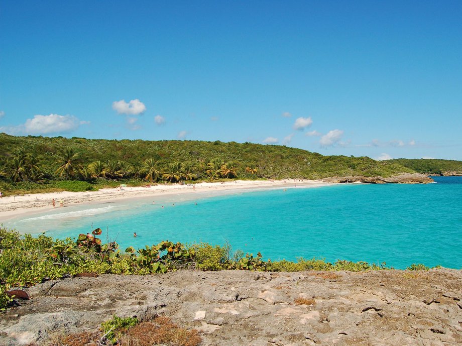 While Navio Beach, which is located on island of Vieques in Puerto Rico, looks like a calm and serene beach, it has plenty of action to offer. Its rolling waves are ideal for surfers and boogie boarders, while its rocky cliffs host hidden caves to explore. Since the road to get to the beach can be muddy, its recommended to rent a vehicle with good suspension.