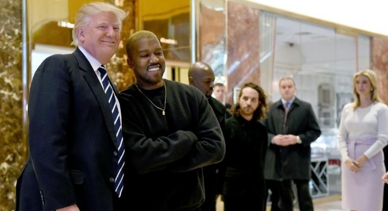 Singer Kanye West and President-elect Donald Trump (L) speak with the press after their meeting at Trump Tower on December 13, 2016 in New York