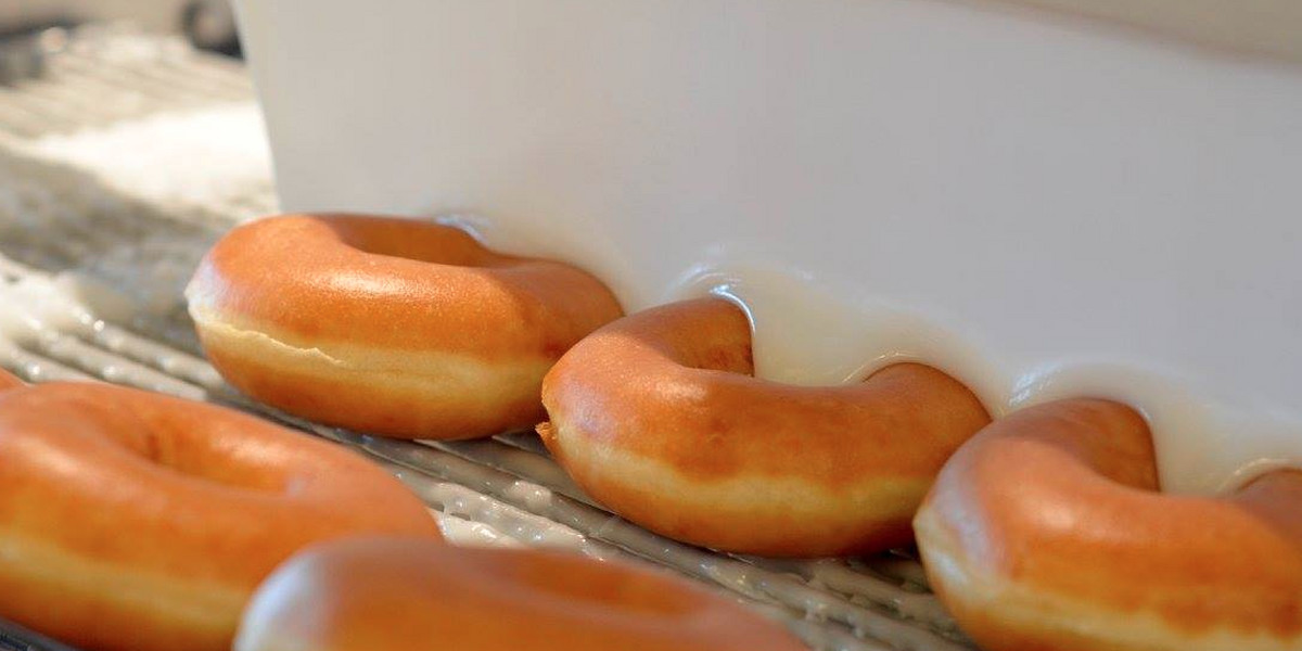 Doughnuts being glazed at Krispy Kreme's Clemmons, North Carolina location
