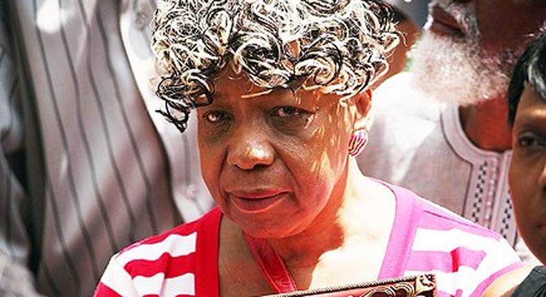 Gwen Carr holding a photo of her late son, Eric Garner