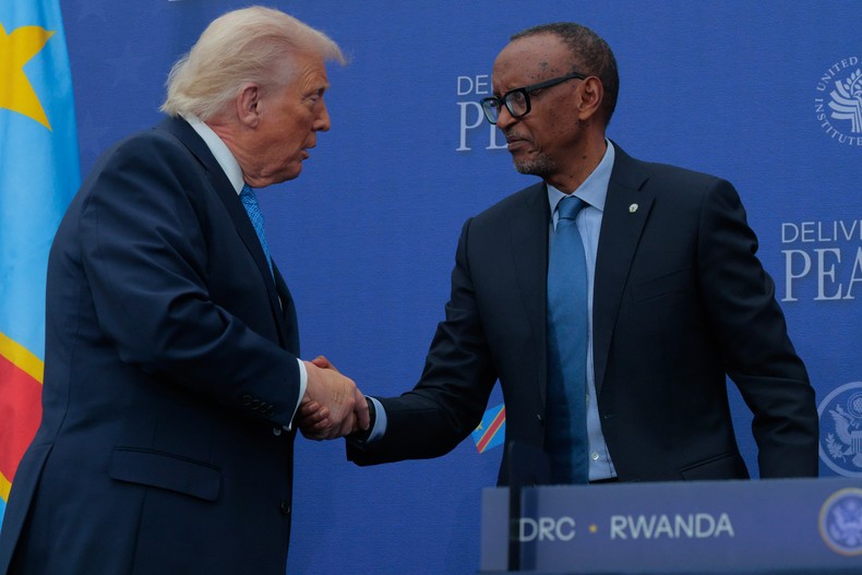 L-R: U.S. President Donald Trump shakes hands with Rwandan President Paul Kagame during a peace agreement signing ceremony between the Democratic Republic of Congo and Rwanda at the Donald J. Trump Institute of Peace on December 04, 2025, in Washington, DC. [Photo by Chip Somodevilla/Getty Images]