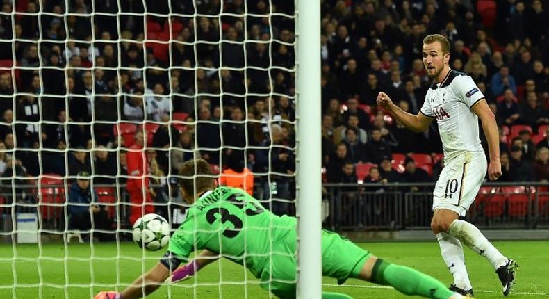 Tottenham Hotspur's striker Harry Kane (R) scores past CSKA Moscow's goalkeeper Igor Akinfeev as Spurs take a 2-1 lead during the UEFA Champions League group E football match between Tottenham Hotspur and CSKA Moscow on December 7, 2016