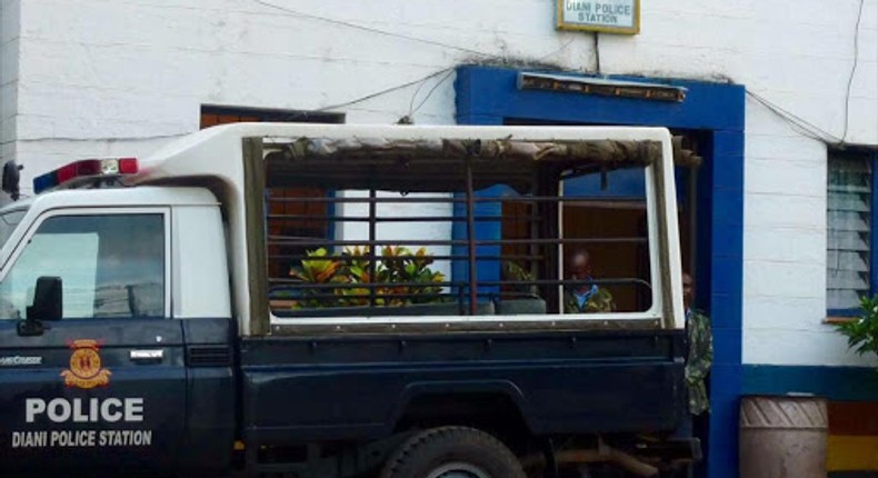 A police vehicle parked outside a police station