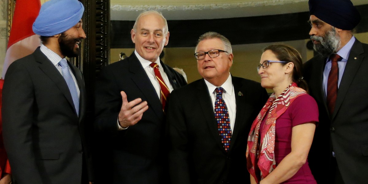 US Homeland Security chief John Kelly, second left, with Canada's Innovation, Science and Economic Development Minister Navdeep Bains, left, Public Safety Minister Ralph Goodale, center, Foreign Minister Chrystia Freeland, second right, and Defense Minister Harjit Sajjan in Ottawa, March 10, 2017.