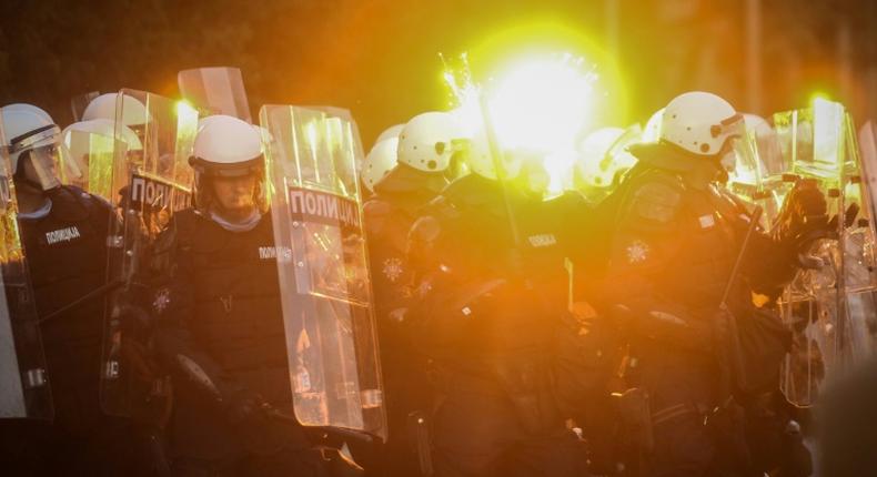 Protestors clash with police in Belgrade on July 8, 2020 as violence erupts against a weekend curfew announced to combat a resurgence of COVID-19 infections