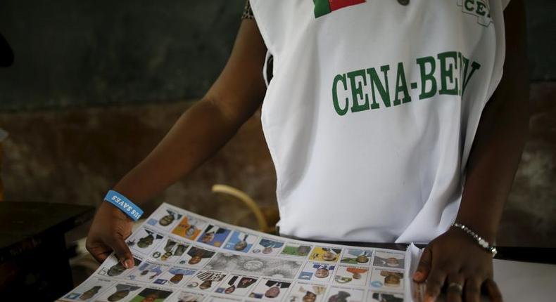 An electoral officer prepares voting materials during a presidential election at a polling station in Cotonou, Benin, March 6, 2016. REUTERS/Akintunde Akinleye