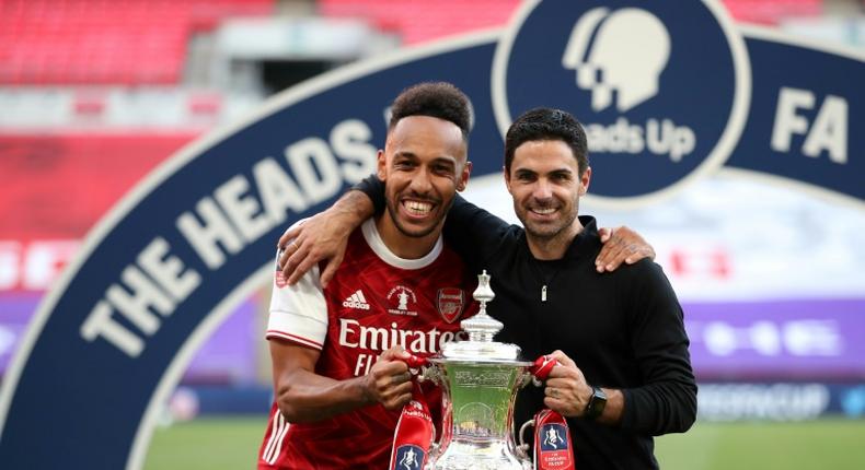 Mikel Arteta (right) is confident Pierre-Emerick Aubameyang (left) will remain at Arsenal