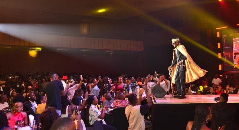 Jose Chameleone pictured on stage as fans cheer on