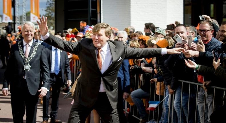 Dutch King Willem-Alexander gestures as he celebrates his 50th birthday on the traditional King's Day (Koningsdag) in the southern city of Tilburg