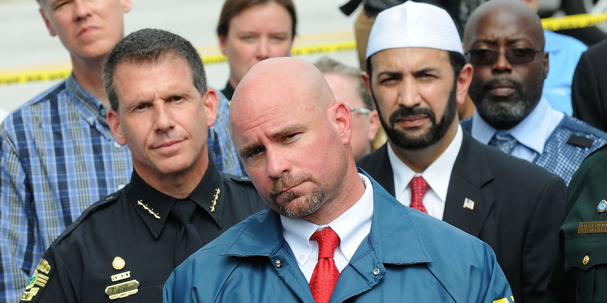 FBI assistant special agent in charge Ron Hopper (C), law enforcement and local community leaders speak during a press conference June 12, 2016 in Orlando, Florida. 50 people are reported dead and 53 were injured at a mass shooting at the Pulse nightclub in what is now the worst mass shooting in U.S. history.