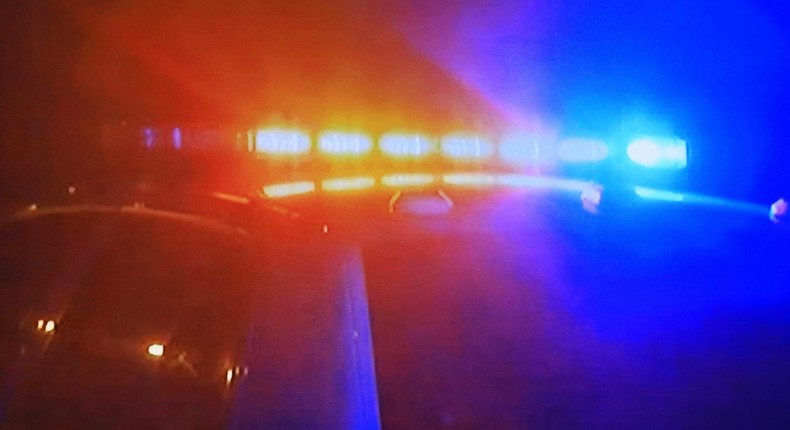 Police car - fast moving with bright flashing lightsGetty Images