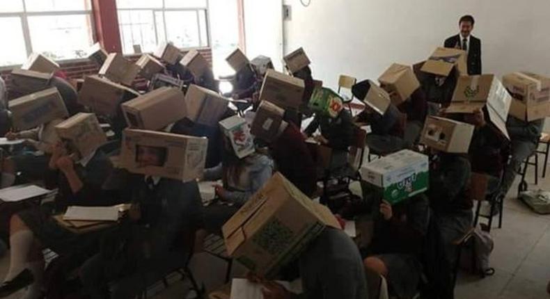 Teacher in trouble for making students wear cardboard boxes in exam hall to avoid cheating 