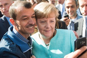 Merkel visits refugee shelter