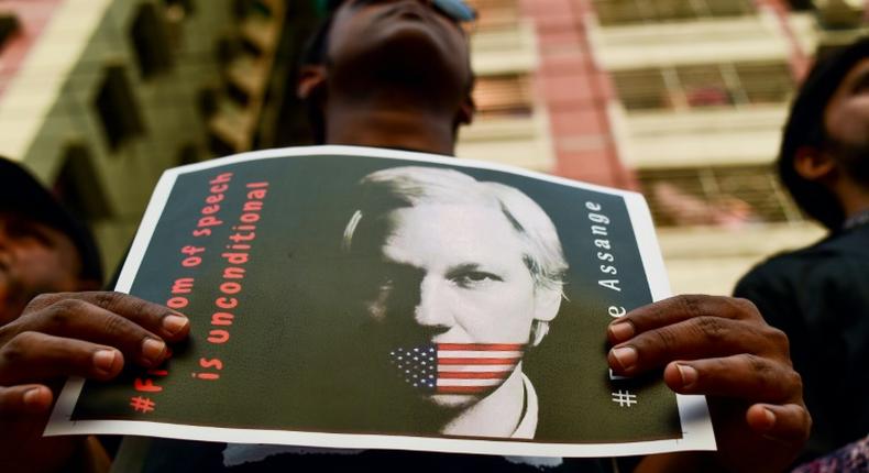 For many, freedom of speech is unconditional, as the placard says, and that includes for WikiLeaks founder Julian Assange