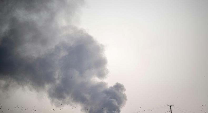 Smoke rises from the Syrian town of Tal Abyad after Turkish bombings