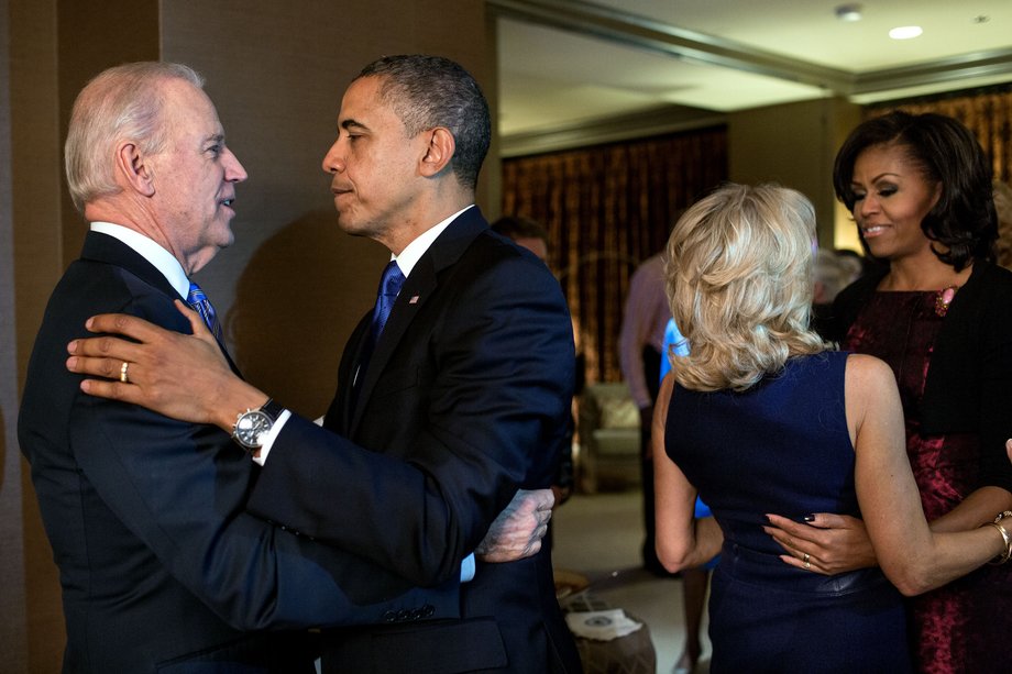 The Obamas embrace the Bidens moments after the television networks called the election in their favor, while watching election returns at the Fairmont Chicago Millennium Park in Chicago.