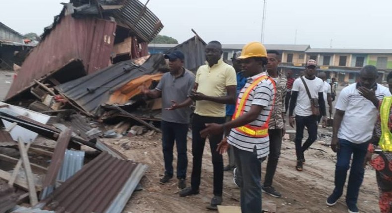 Cross River State Commissioner for Environment, Mr Mfon Bassey (right) during the demolition exercise (NAN)